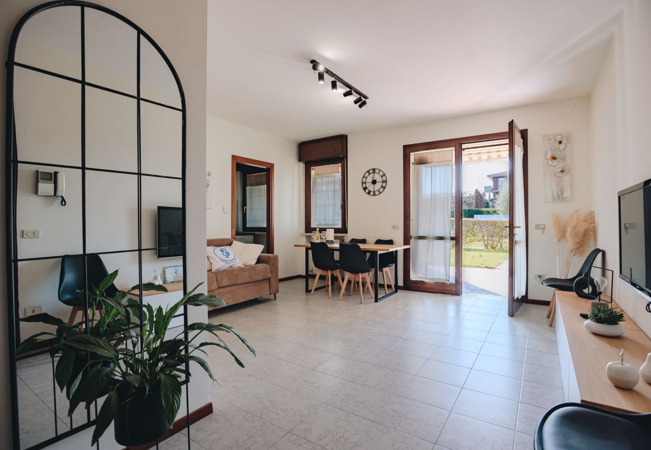 Modern living room with access to the garden in an apartment in Peschiera del Garda